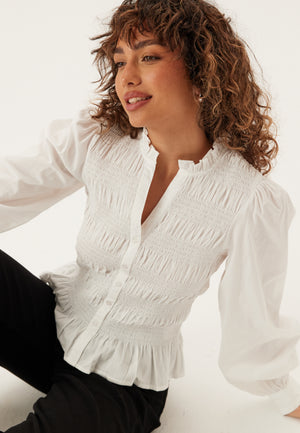 V-hals bomullssmocket bluse