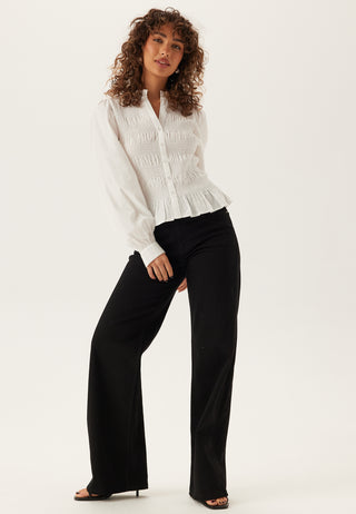 V-hals bomullssmocket bluse